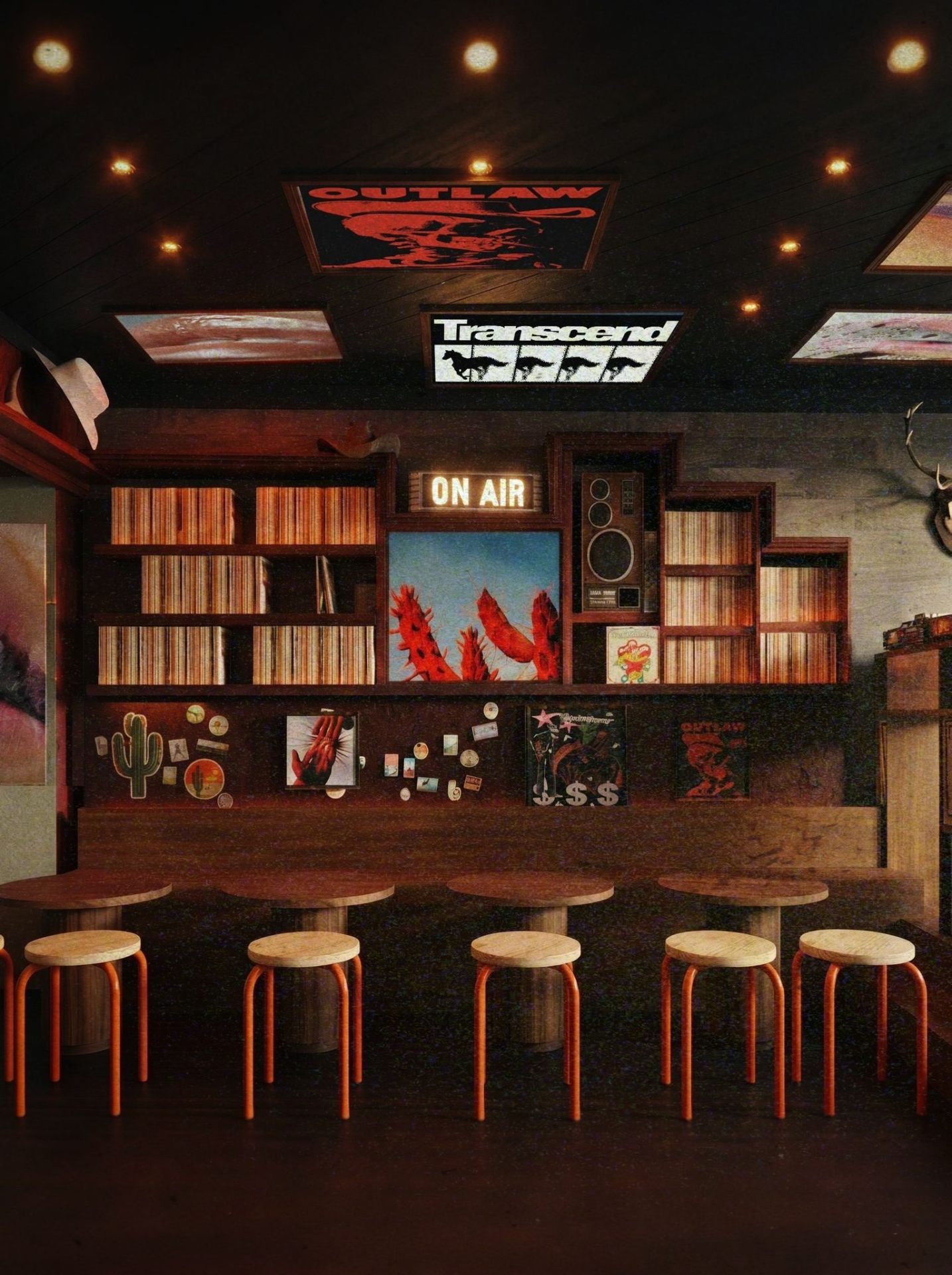 Toon Saloon long bar with wall of vinyl records, ON AIR sign, cactus artwork and orange stools at wood tables